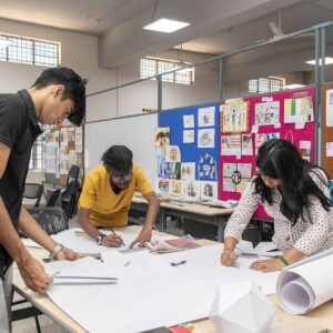 A group of three students doing activities at college