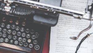 Display of a typewriter with a paper beside in a communication design collage in chennai