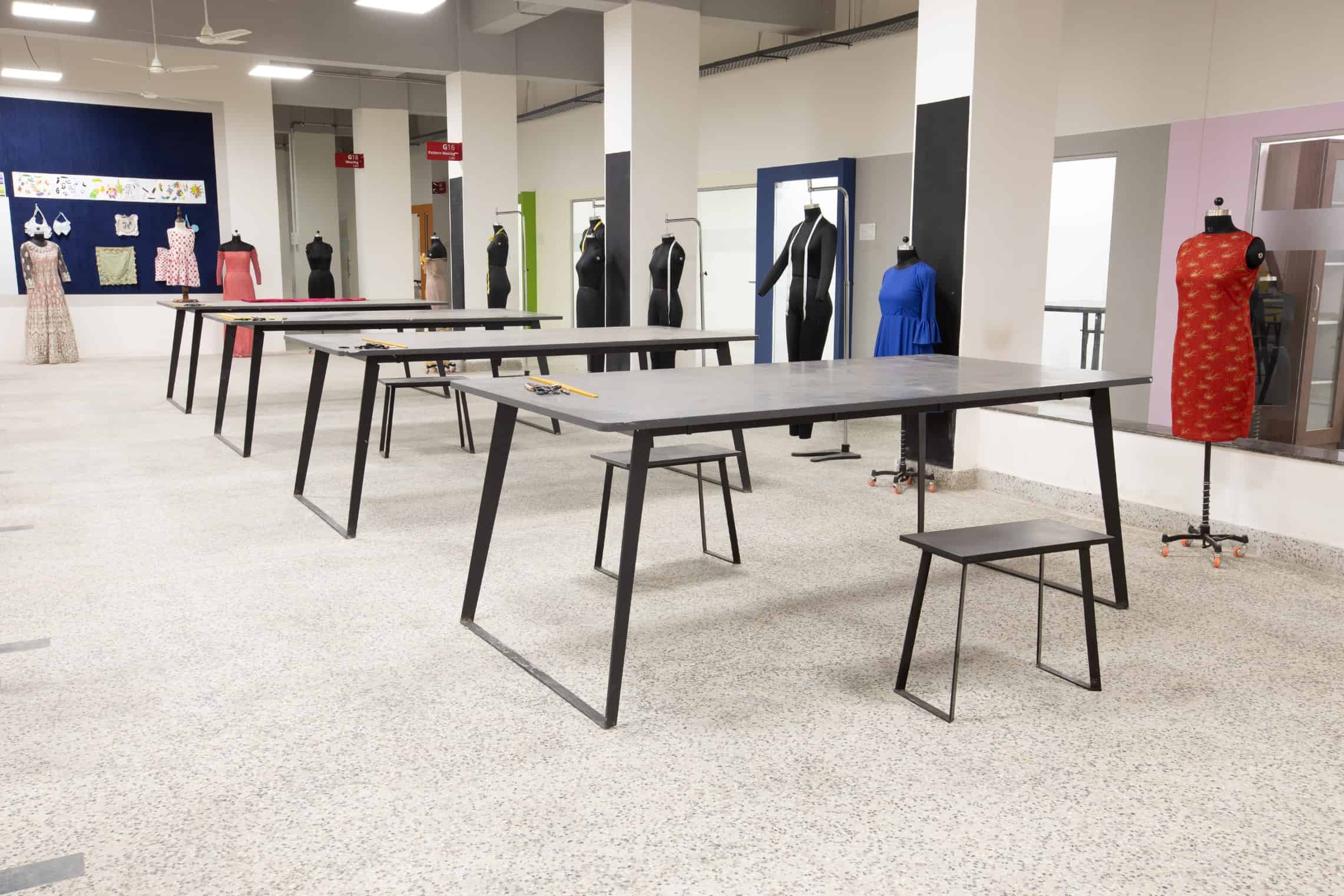 Fashion design studio room with large fabric cutting table at a design college in Chennai