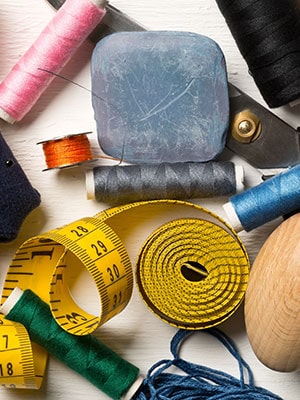 Display of fashion design accessories like measuring tape, threads, scissors