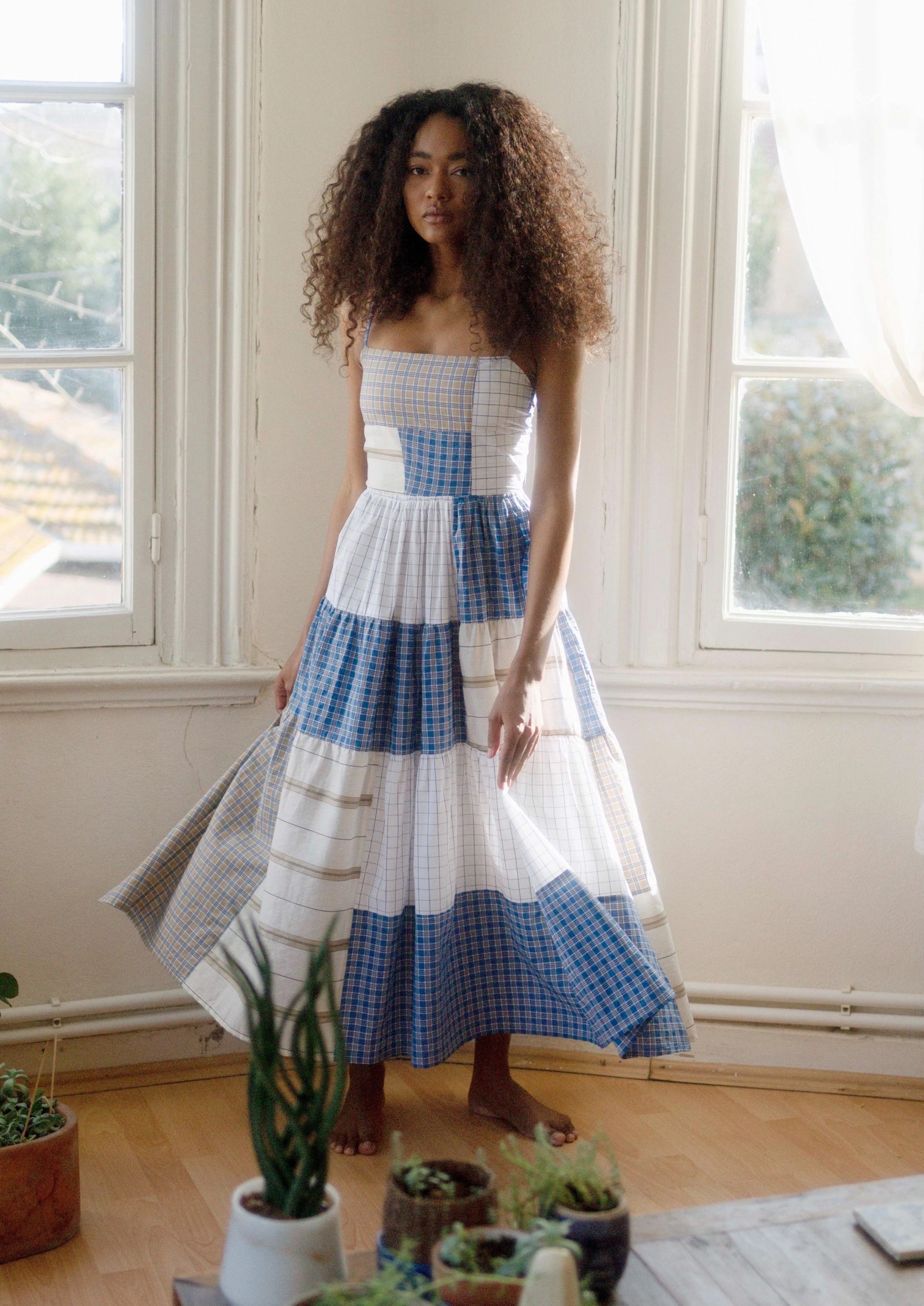 Young girl with curly hair wearing zero waste fashion cloth